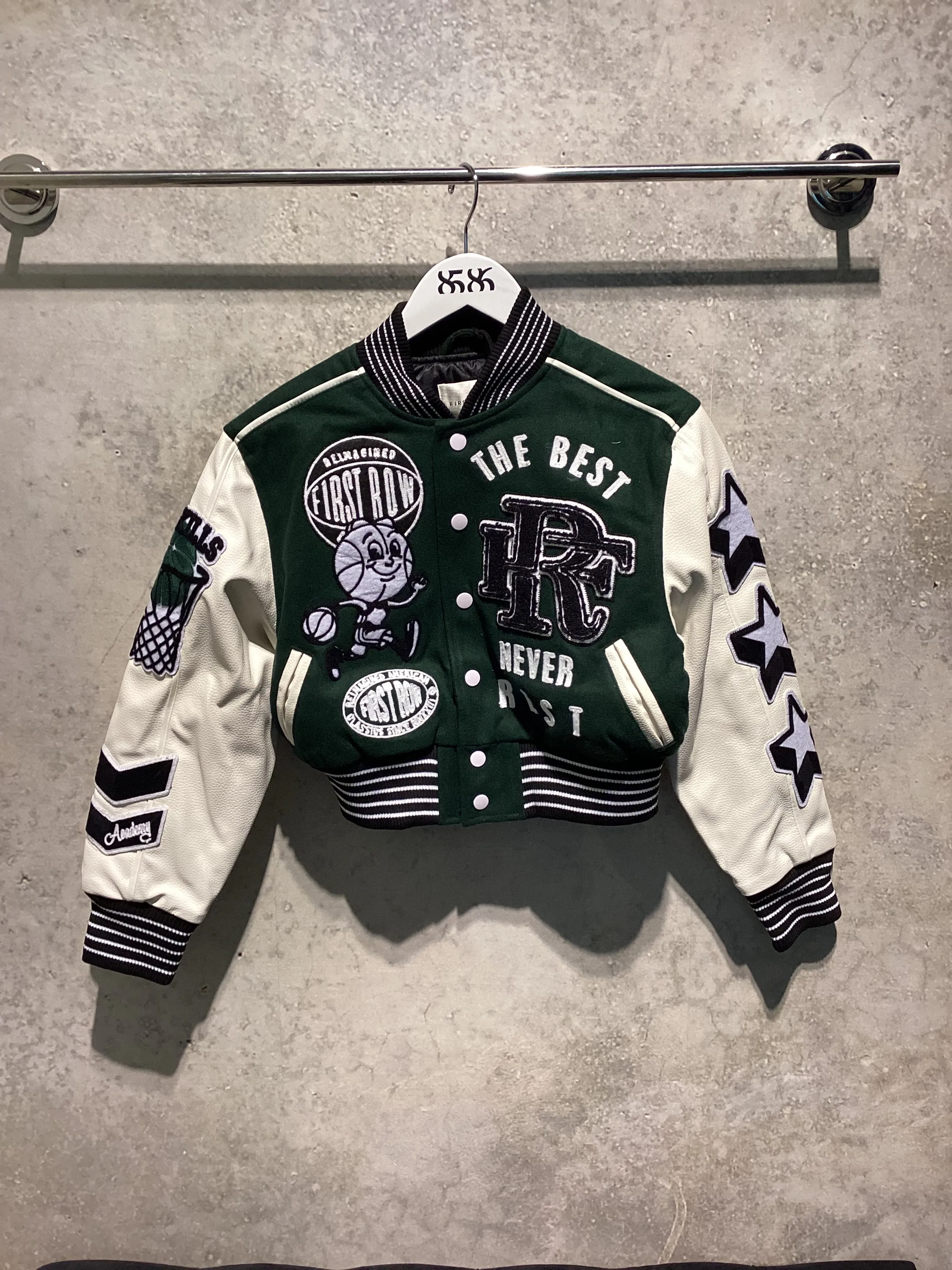 FIRST ROW: THE BEST NEVER REST CROPPED VARSITY JACKET