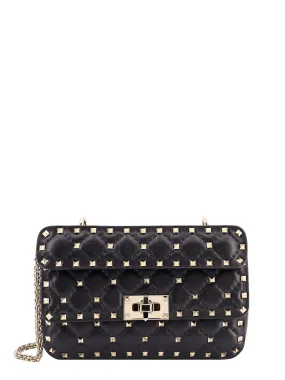 Leather shoulder bag with iconic studs